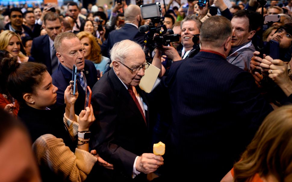Man in suit pictured in crowd of people