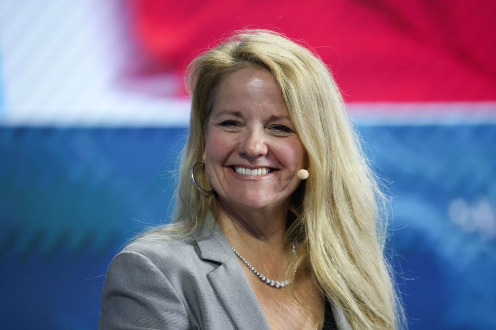 Gwynne Shotwell in a gray suit.