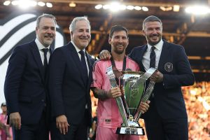 José Mas, Jorge Mas and Sir David Beckham, co-owners of Inter Miami CF pose with the Champion's trophy next to Lionel Messi #10 after winning the Audi 2025 MLS Cup Final match between Inter Miami CF and Vancouver Whitecaps FC at Chase Stadium on December 06, 2025 in Fort Lauderdale, Florida.