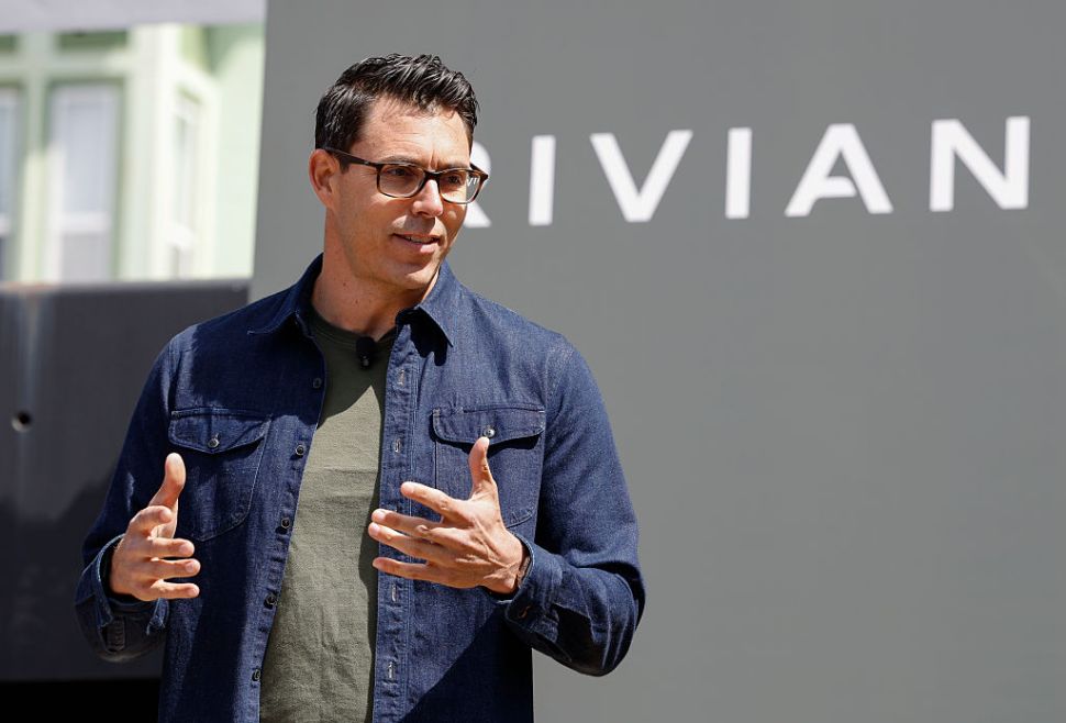 Rivian CEO RJ Scaringe in a navy blue casual shirt