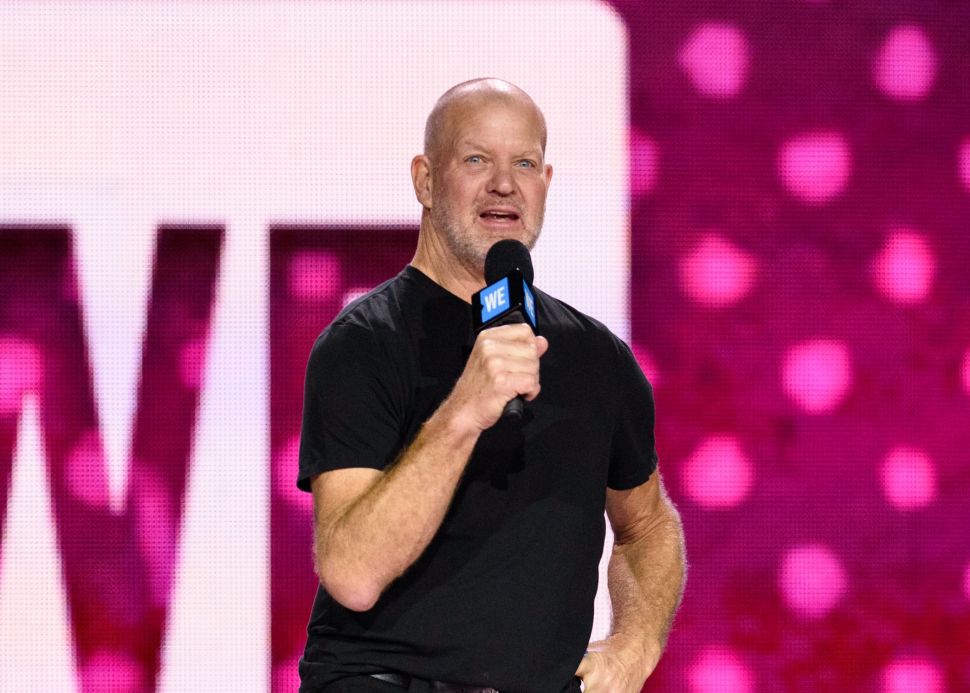 Lululemon founder Chip Wilson speaking onstage.