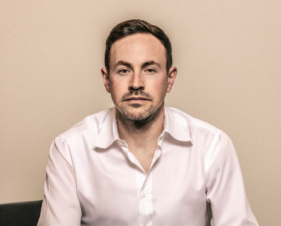 Image of man in white button up 